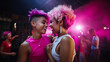 © XaMaps - Two young lesbians in pink dresses dancing at a club.
