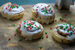 Cinnamon rolls with Christmas sprinkles and icing closeup for sweet holiday breakfast food.