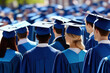 Graduates in blue academic caps during a commencement ceremony, celebrating achievement