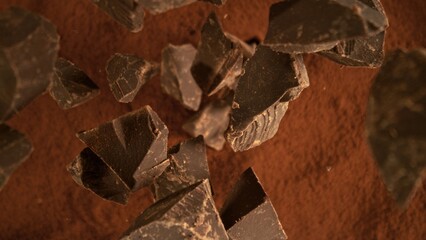 Poster - Freeze motion of flying group of raw chocolate pieces.