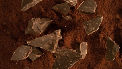 Poster - Freeze motion of flying group of raw chocolate pieces.