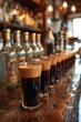 A row of glasses filled with dark liquid on a bar, AI