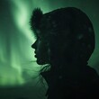 Enigmatic Figure Silhouetted in Shadow Beneath Aurora Borealis, Intense Close-Up Shot with Moody Lighting