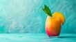 © Anastasia Knyazeva - A mango with mango cocktail, set against a pastel blue background for summer concept. Web banner with copyspace on the right side