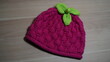 red and green knitted fabric. red winter hat