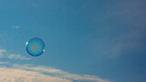 Fototapeta Tęcza - Soap ball against the blue sky.