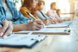 © Aleksandr - group of people sitting at a table and writing notes