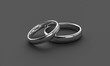 Illustration of two silver wedding rings on darkbackground. Love concept