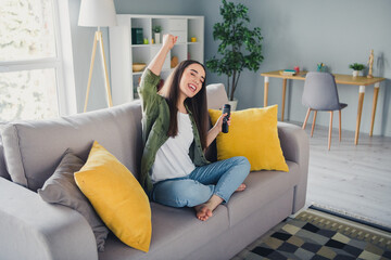 Canvas Print - Full size photo of pretty young woman watch sports raise fist wear shirt modern interior apartment indoors