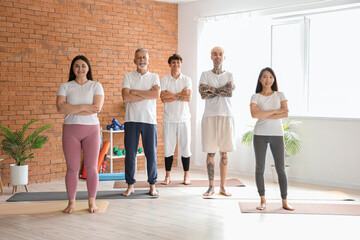 Sticker - Group of sporty people training in gym