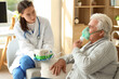 © Pixel-Shot - Senior man with nebulizer and nurse at home