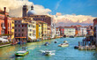 Grand Canal in Venice Italy. Panoramic view to picturesque landscape city and cathedral Dome. Motorboats cutters on water. Sunny summer day with blue sky sunset dramatic clouds
