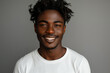 © Spicy World - Smiling black man in white sweatshirt with dreadlocks, close-up portrait, copy space