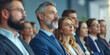 © rohappy - Group of business people at seminar, official meeting, people in business suits listening to speech