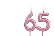 Lit birthday candle - Candle number 65 on white background