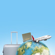 Globe, airplane, passport, and suitcase on a colored background. Ready for traveling