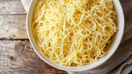 Poster - a white bowl of noodles sits on a wooden table