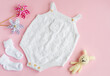 Set of white clothes and accessories for newborn baby. Knitted toys, knitted romper, socks