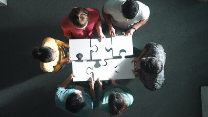 Sticker - Top view of business people separated jigsaw together at meeting. Aerial view of diverse team put piece of jigsaw puzzle together out and standing while wearing casual cloth at conference. Symposium.