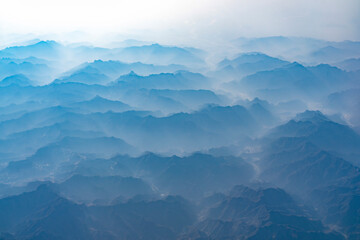 Wall Mural - aerial view of mountain range in fog
