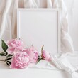 A white frame with pink flowers in it