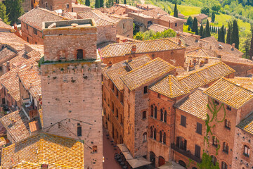 Medieval San Gimignano hill town with skyline of medieval towers, including the stone Torre Grossa. Province of Siena, Tuscany, Italy.