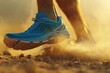 Close-up of a runner's feet wearing blue trail running shoes, kicking up dust and sand