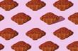pattern of flat croissant on pink background