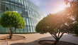 Sustainable green building. Eco-friendly building. Sustainable glass office building with tree for reducing carbon dioxide. Office with green environment. Corporate building reduce CO2.
