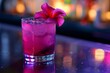 © wpw - Tropical Cocktail with Flower Garnish at Nighttime Bar