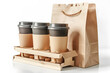 a row of coffee cups in a wooden crate