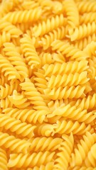 Wall Mural - Heap of uncooked italian pasta rotation