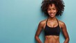© AndreyFrol - Banner with a portrait of a dark-skinned smiling girl with an athletic build on a blue background. Blank space for text. Advertising concept for a fitness club