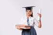 © StockImageFactory - Indian asian cute little school girl wesra graduation white against white background