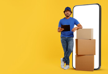 Sticker - Courier with stack of parcels and clipboard near huge smartphone on golden background. Delivery service. Space for text