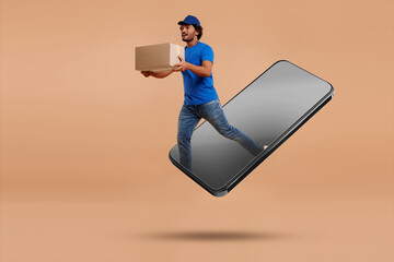 Wall Mural - Courier with parcel jumping out from huge smartphone on dark beige background. Delivery service