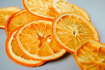 A vivid display of dried orange slices, with their intricate details and bright orange color, creating a striking visual contrast on a clean background