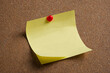 yellow sticky note on cork board empty with copy space