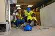 © eakarat - Skilled factory worker saves teammate's life from industrial accident human engineering and safety concepts