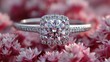 © lemoncraft - Sparkling diamond engagement ring with intricate halo setting surrounded by soft pink floral petals