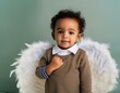 petit enfant métis avec des ailes d'ange et un pull marron, en ia