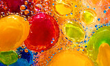 Fototapeta Kwiaty - Bright multi-colored bubbles and drops, abstract liquid background