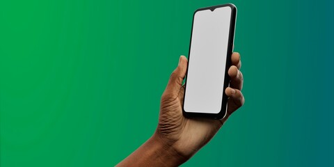 Wall Mural - African-American hand with smartphone against green; great for app showcases