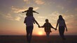 © maxximmm - people in the park. big family silhouette walk at sunset. mom dad and daughters walk holding hands in the park. large family kid dream concept. parents and children walking back fun silhouette