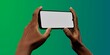 African-American hand with smartphone against green; great for app showcases