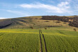A view over fields in the South Downs towards Kingston Ridge, on a sunny spring day