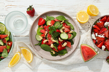 Wall Mural - Watermelon and fresh fruit salad in a bowl on a white background
