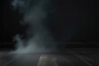 © Arsenii - Empty dark background with smoke or fog hovering on the floor.