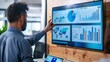 © Mahemud - Businessman presenting data analysis dashboard display on TV screen in modern meeting for marketing strategy. Business presentation with group of business people in conference room. Concord