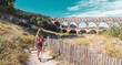 Woman tourist in France, Pont du Gard